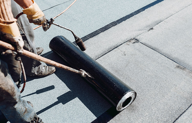 Flat roof with elastomeric membrane.